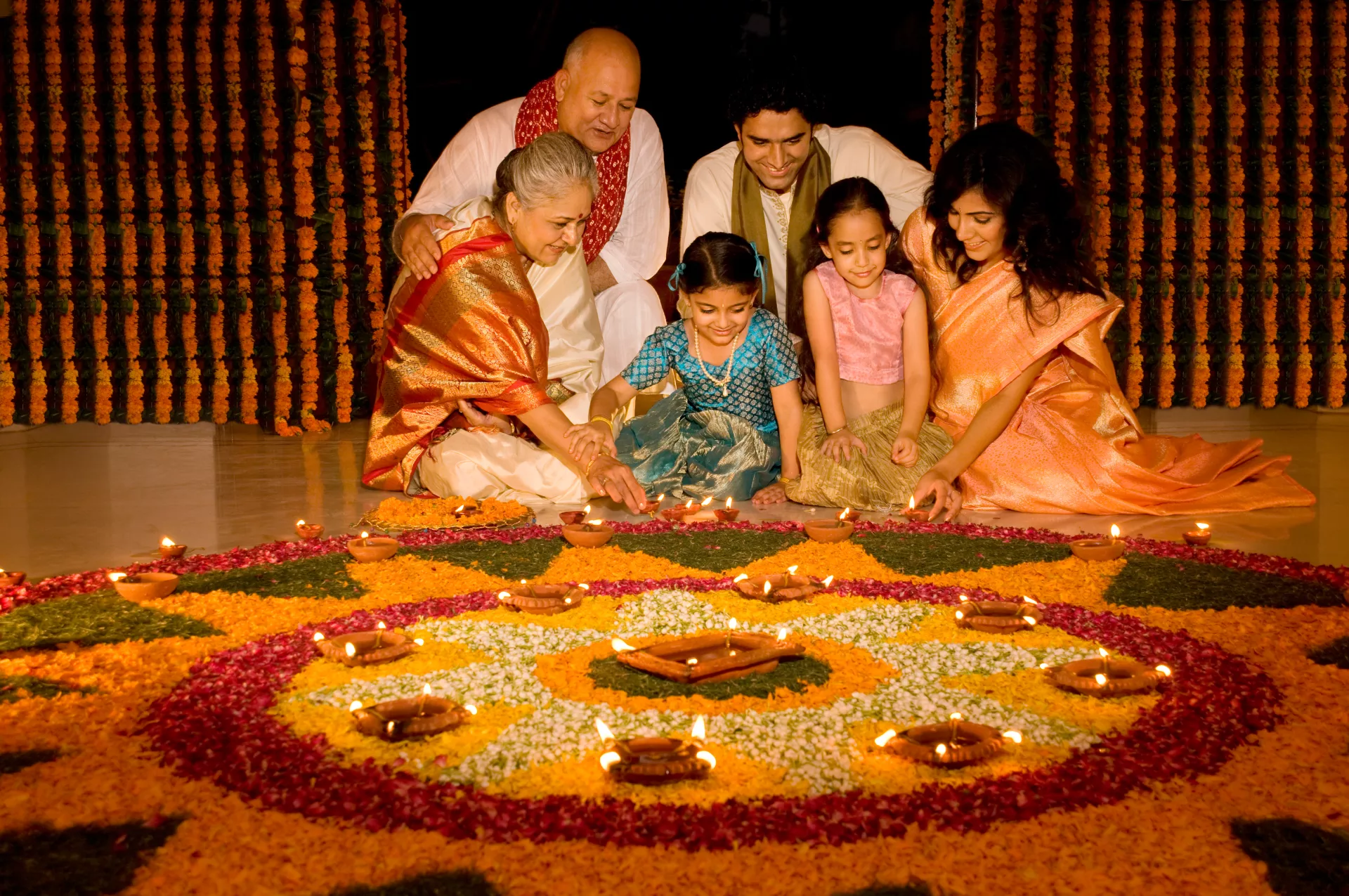 An Indian family celebrating Diwali using sustainable Diwali decoration items