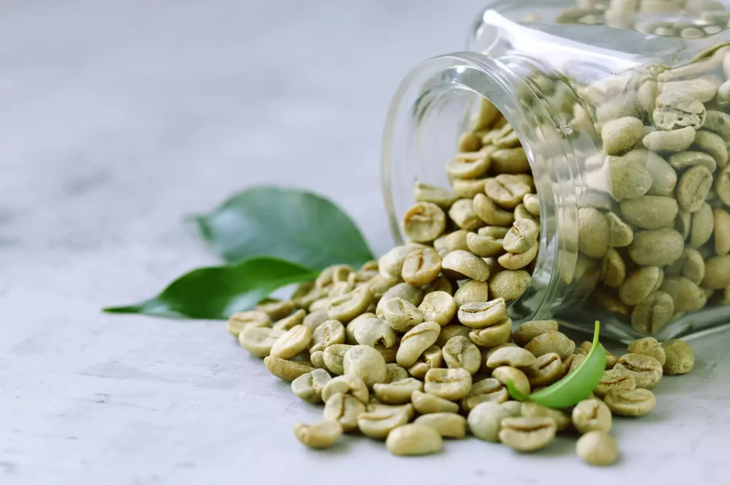 A cup full of green coffee beans