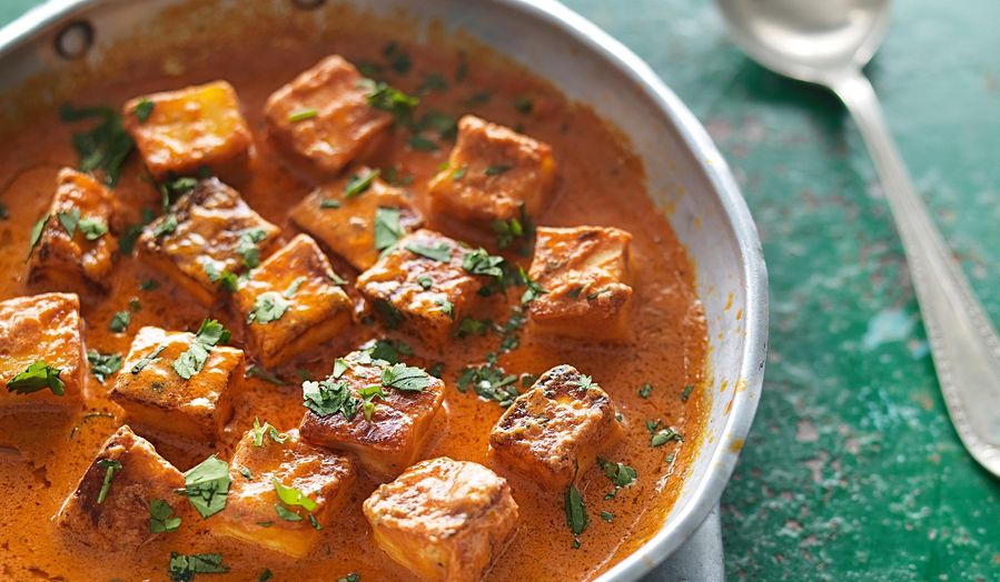 A bowl full of cottage cheese tomato