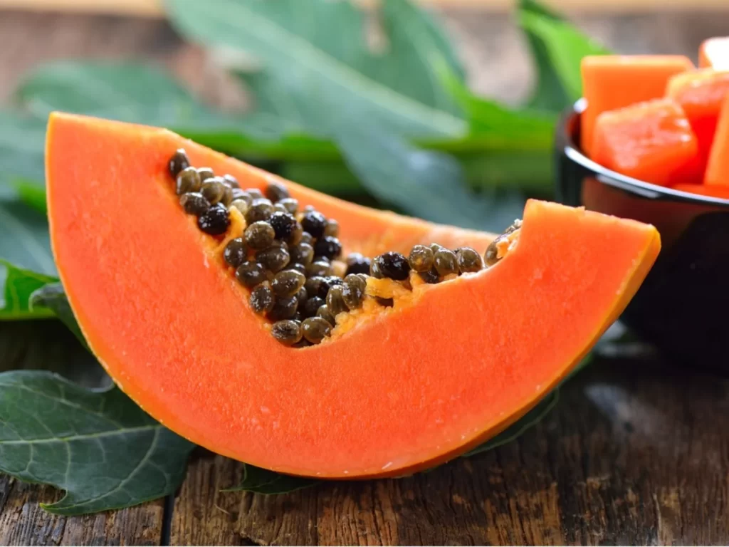 A sliced piece of papaya